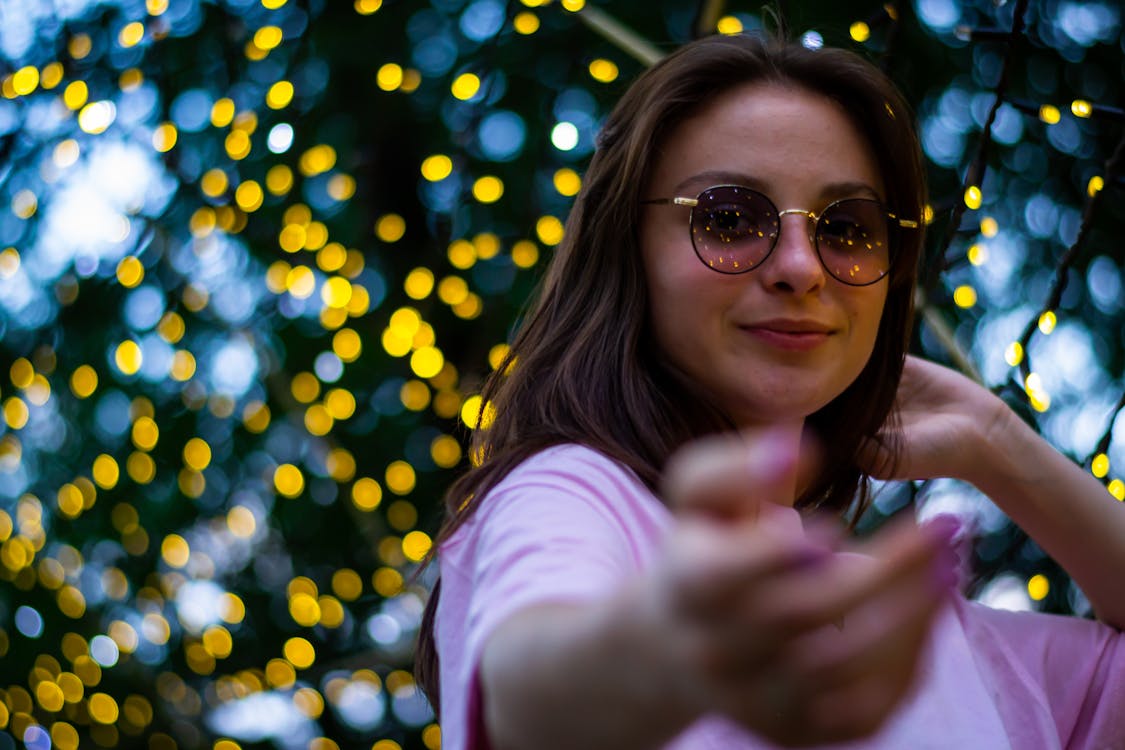 Close-Up Shot of a Woman with Sunglasses Smiling