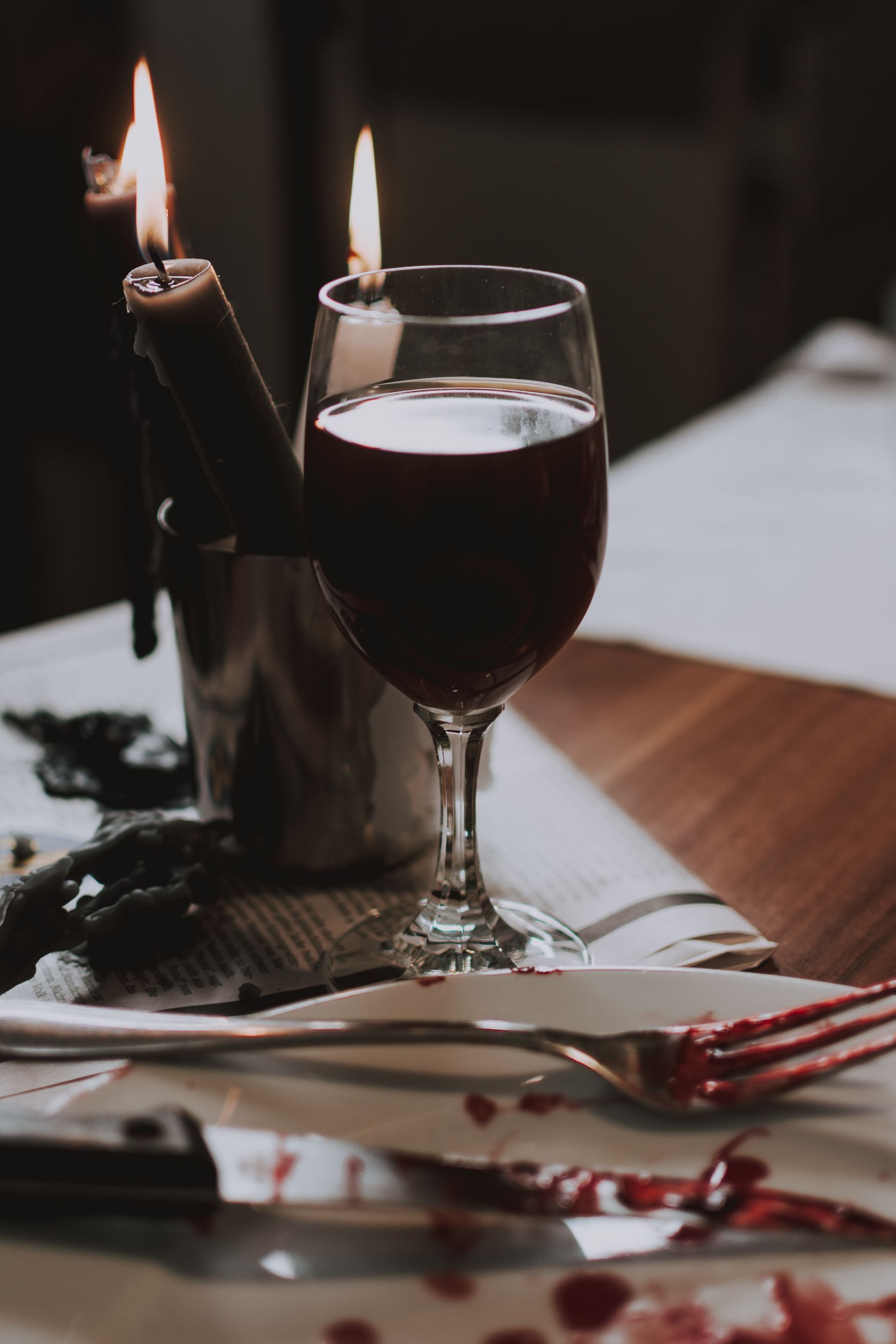 Glass of red wine by candlelight