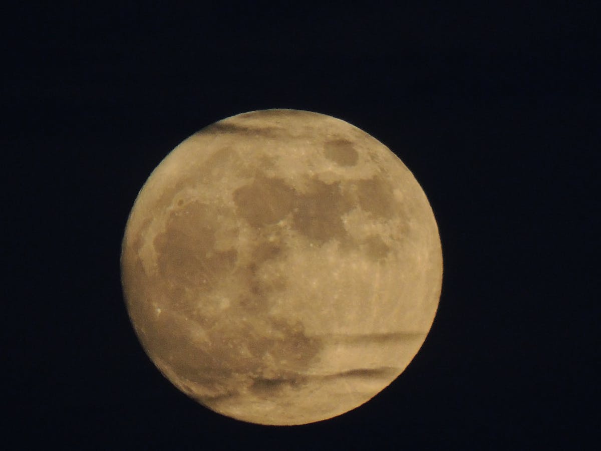 Community health worker speaking with a small group of people