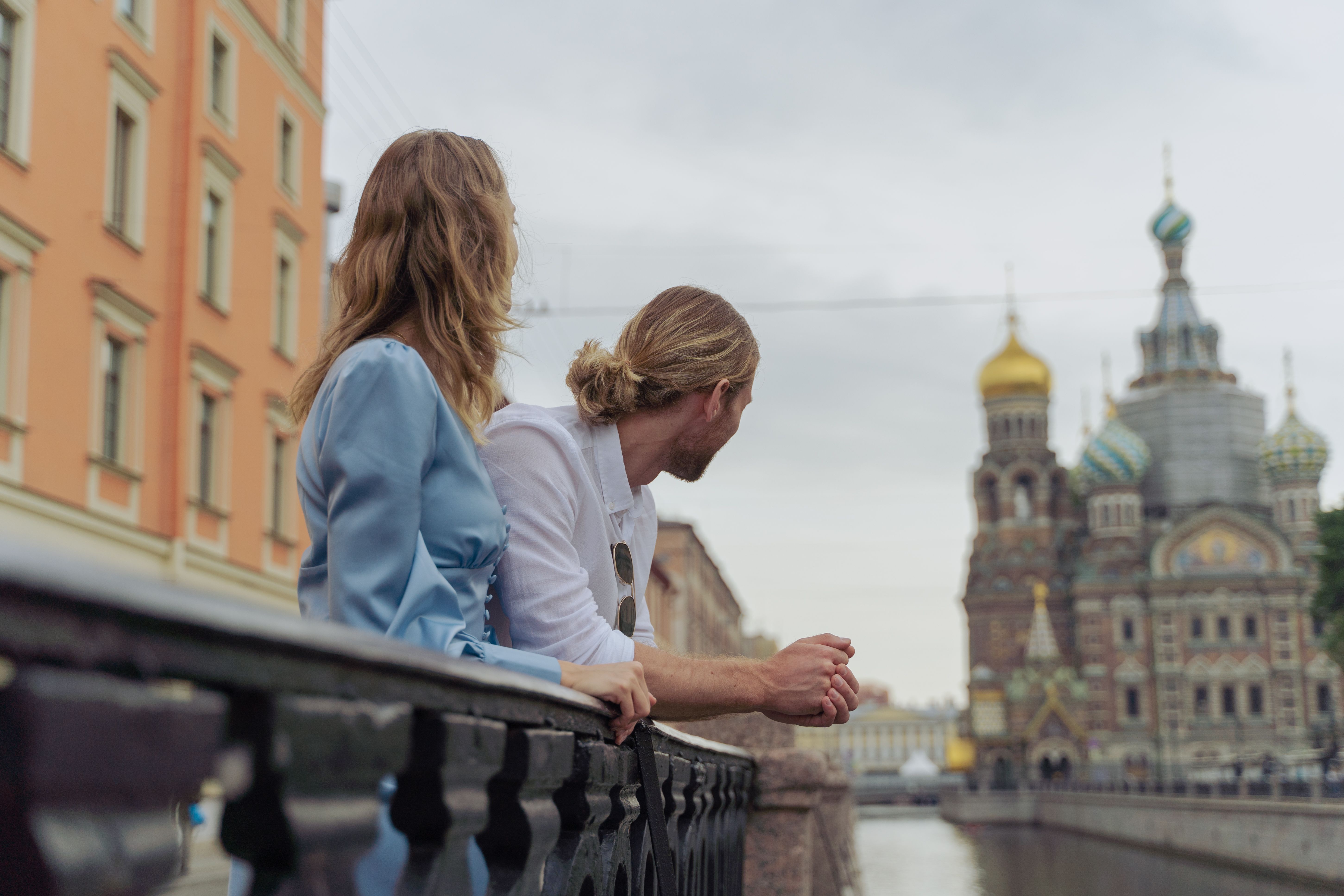 A couple admires the Church of the Savior on Spilled Blood in Saint Petersburg, Russia.