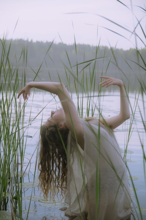 Woman Posing on Shallow Water