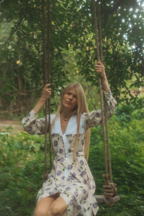 Woman Sitting on a Swing