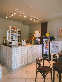 Charming coffee shop interior with contemporary design and inviting ambiance, perfect for a relaxed experience.