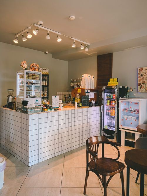 Free Charming coffee shop interior with contemporary design and inviting ambiance, perfect for a relaxed experience. Stock Photo