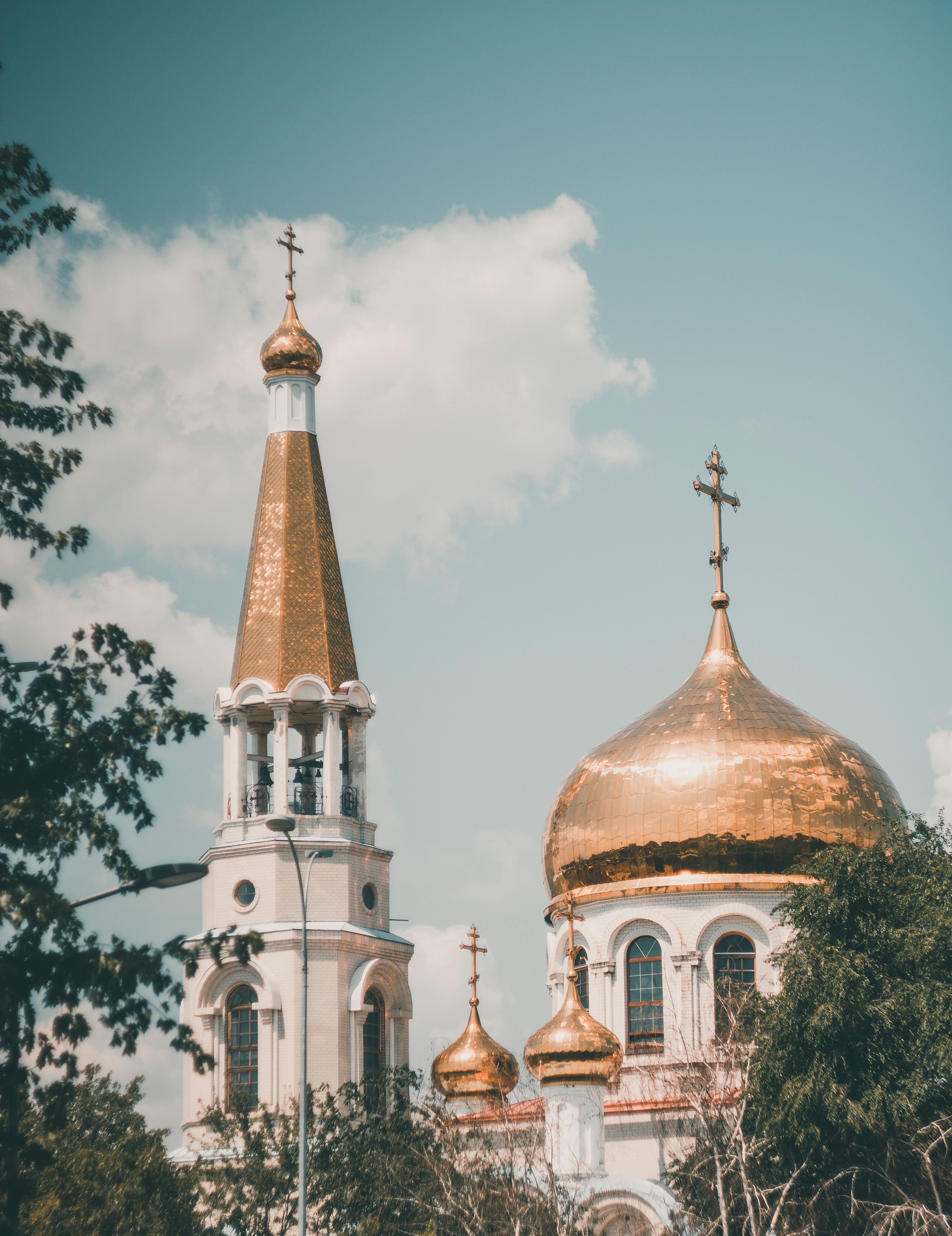 A White and Gold Concrete Church with Crosses on Domes · Free Stock Photo