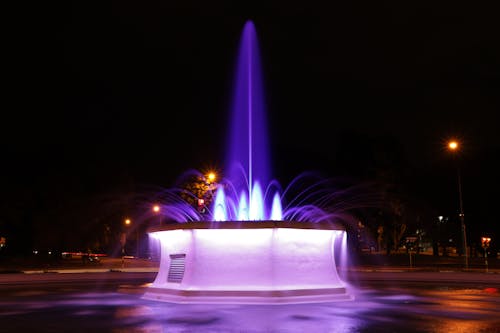 Fountain in the Middle of the City during Night Time