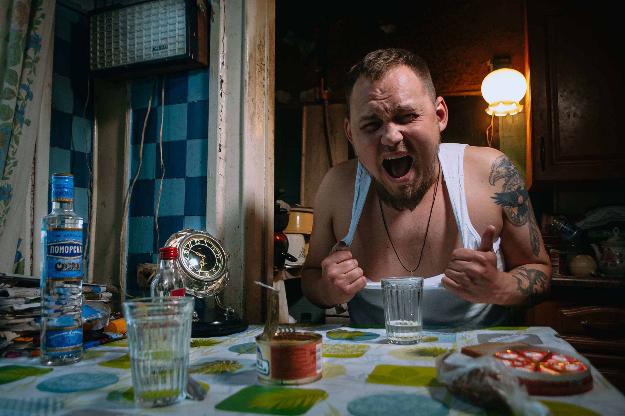 Man Sitting by Kitchen Table Screaming · Free Stock Photo