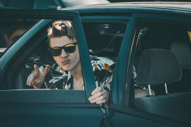 Cool Guy Looking Out Of Car Window