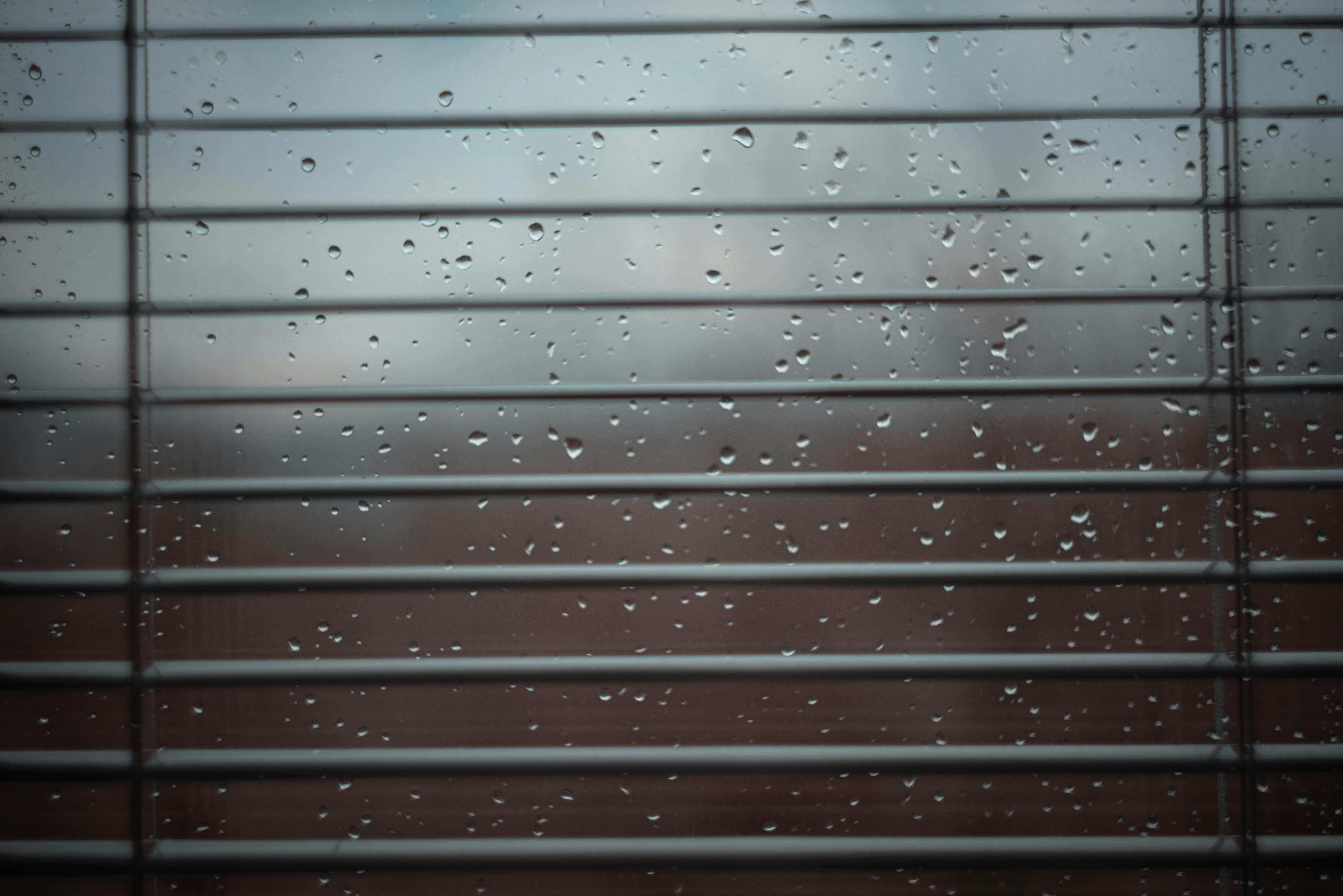 Window Blinds behind Wet Glass · Free Stock Photo