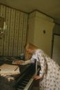 Woman in White and Blue Floral Robe Sitting on Chair