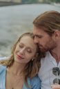 Man and Woman Smiling Near Body of Water