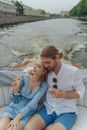 Couple Drinking Together While Riding a Boat