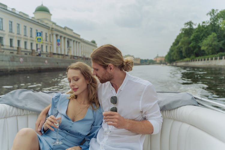 A Couple Riding On A Boat On The Neva River