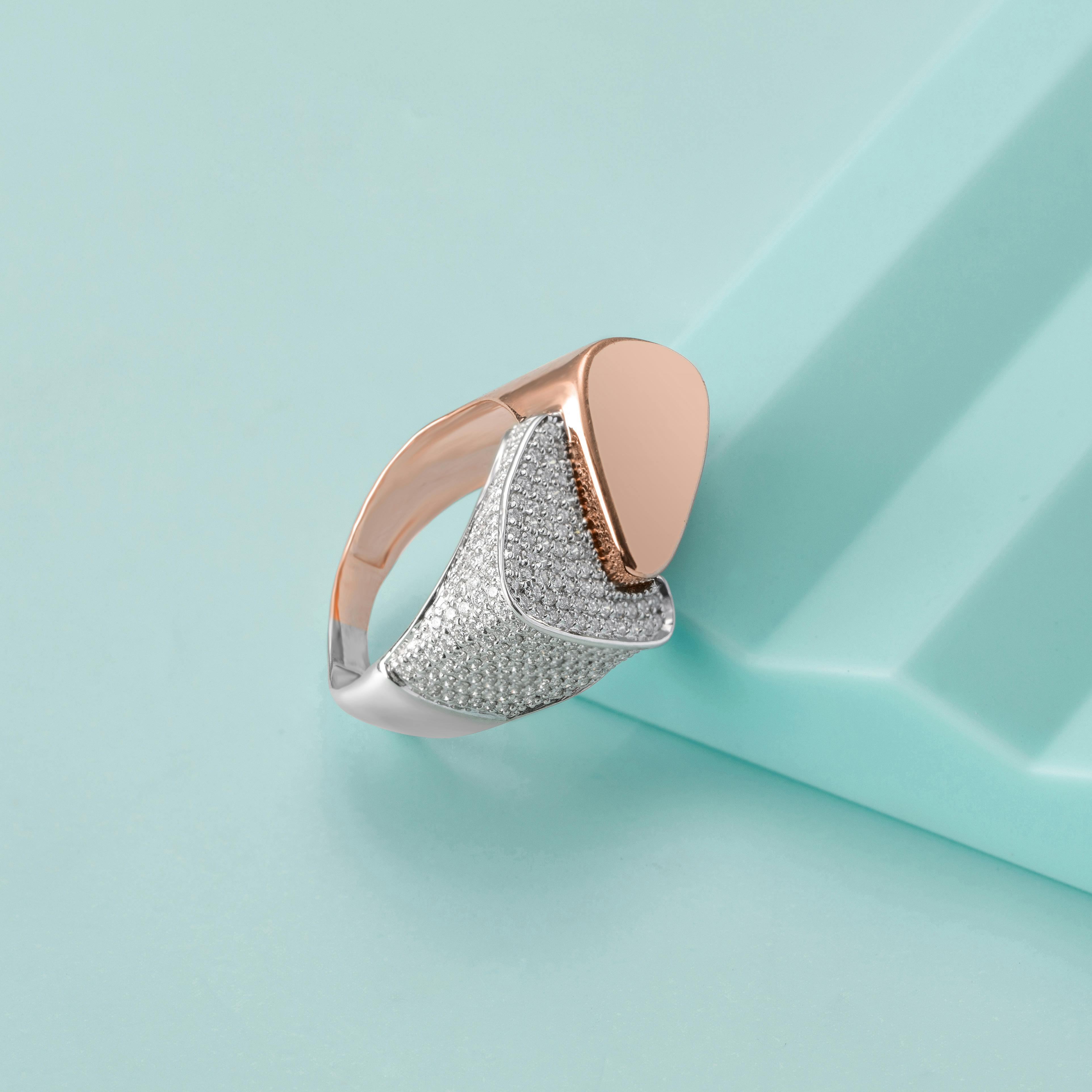 silver and rose gold ring with diamonds