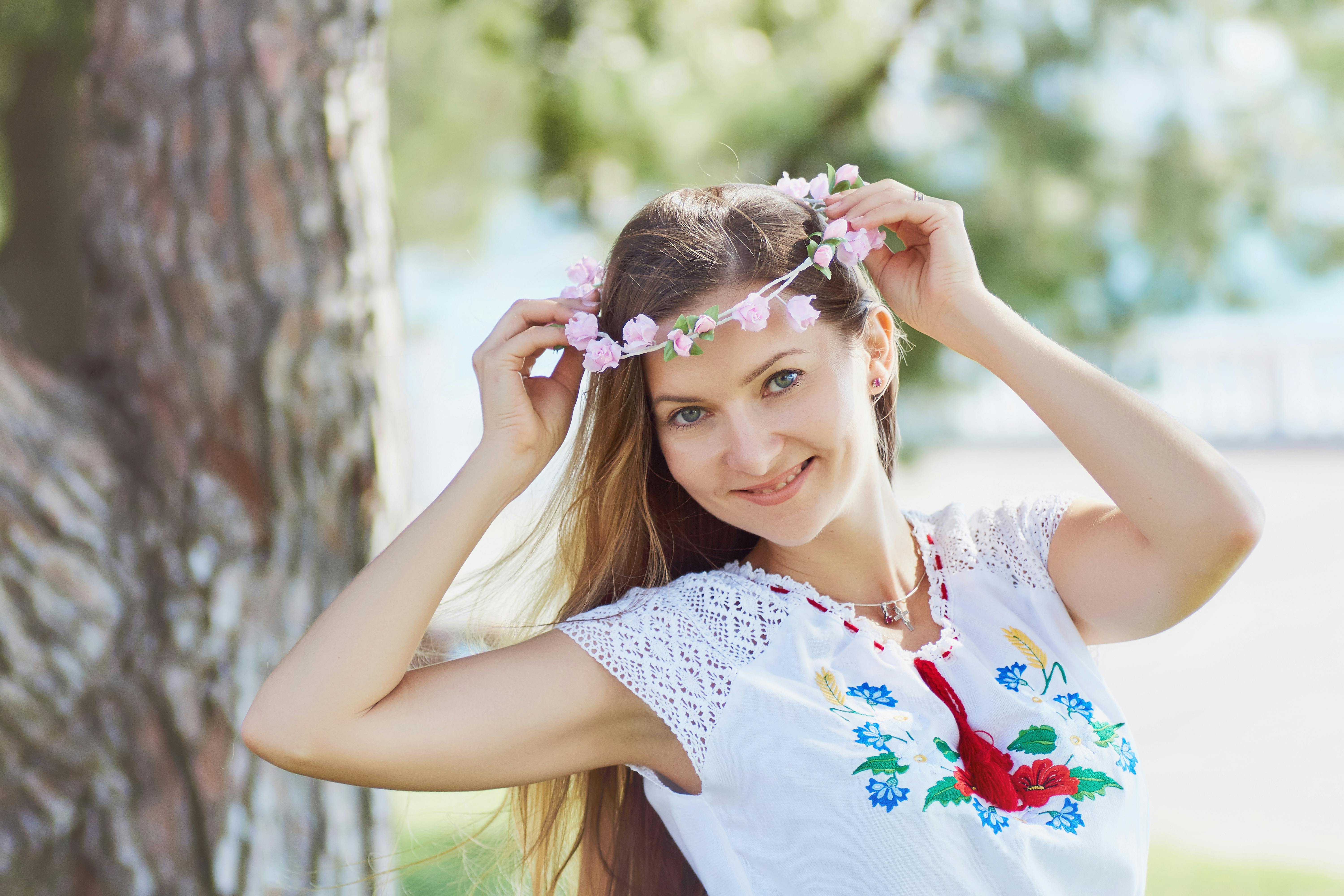 A sleek, modern mobile cooler unit parked discreetly at an outdoor wedding venue, with floral arrangements visible inside - flower cooler rental