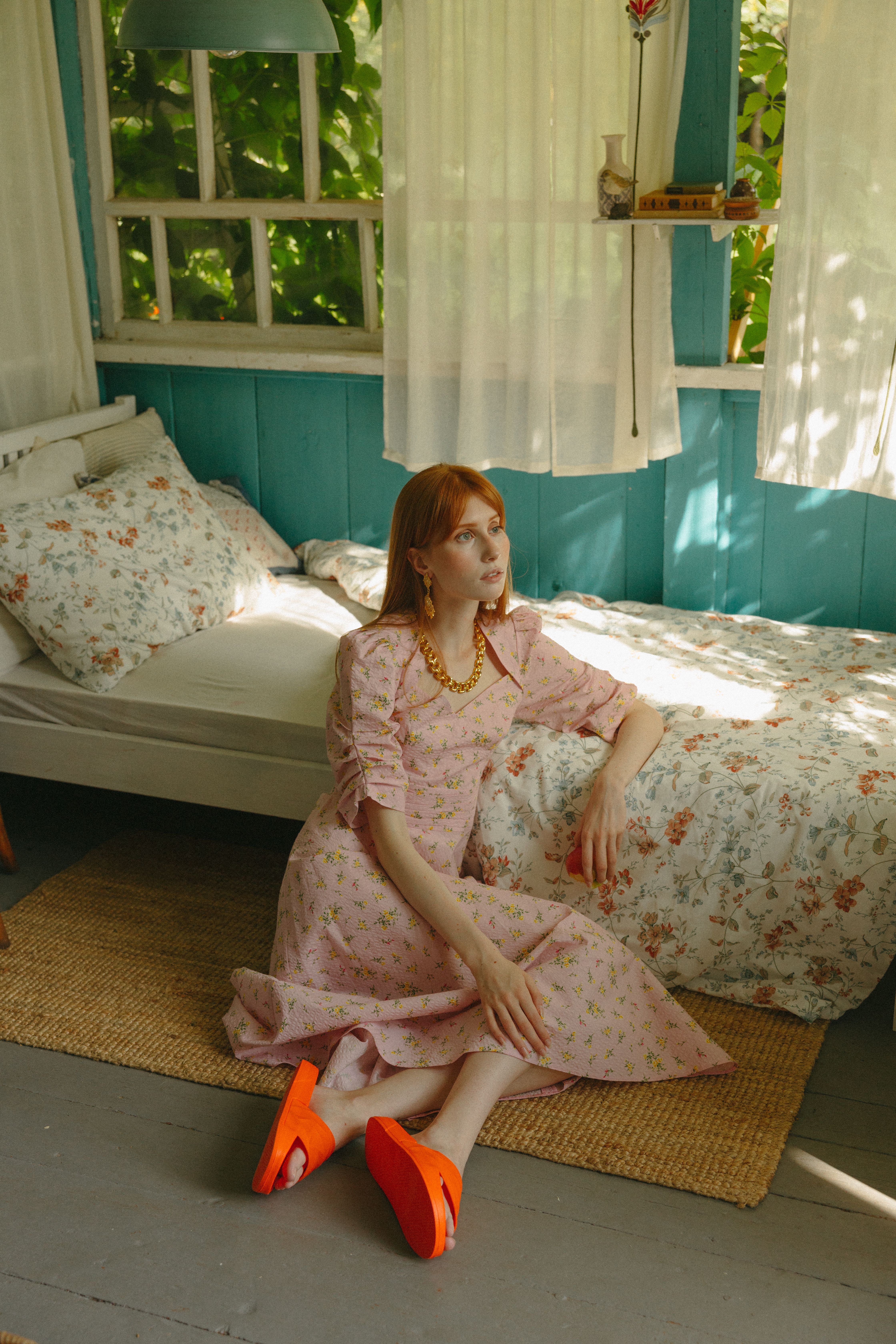 A Woman in a Pink Dress Sitting on the Floor · Free Stock Photo