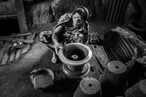 A Woman Holding a Wet Clay