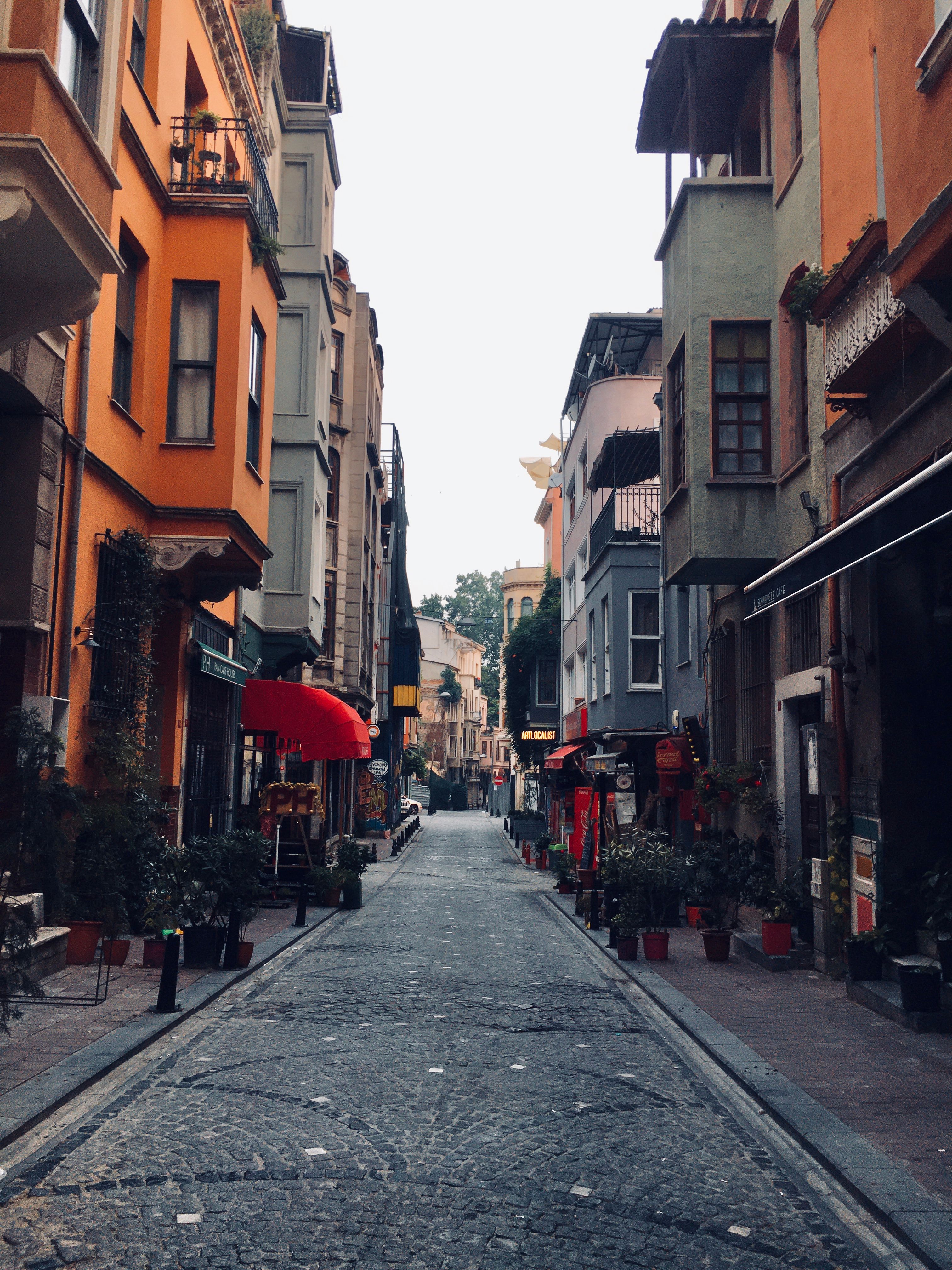 Cobblestone Street Between Orange Buildings · Free Stock Photo
