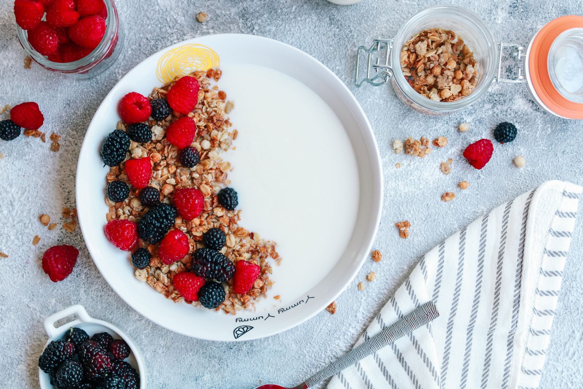 Delicious breakfast bowl featuring granola, yogurt, raspberries, and blackberries for a nutritious start.