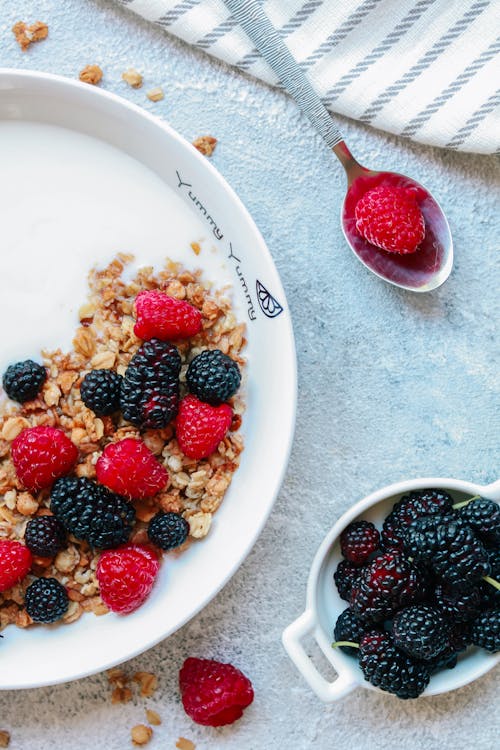 Free Red and Black Berries on White Ceramic Bowl Stock Photo