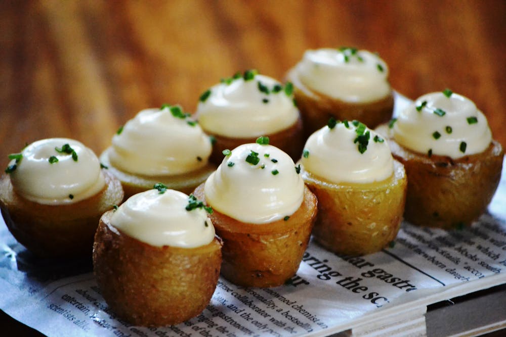 Spicy Air Fryer Baked Potatoes with Sriracha Sour Cream