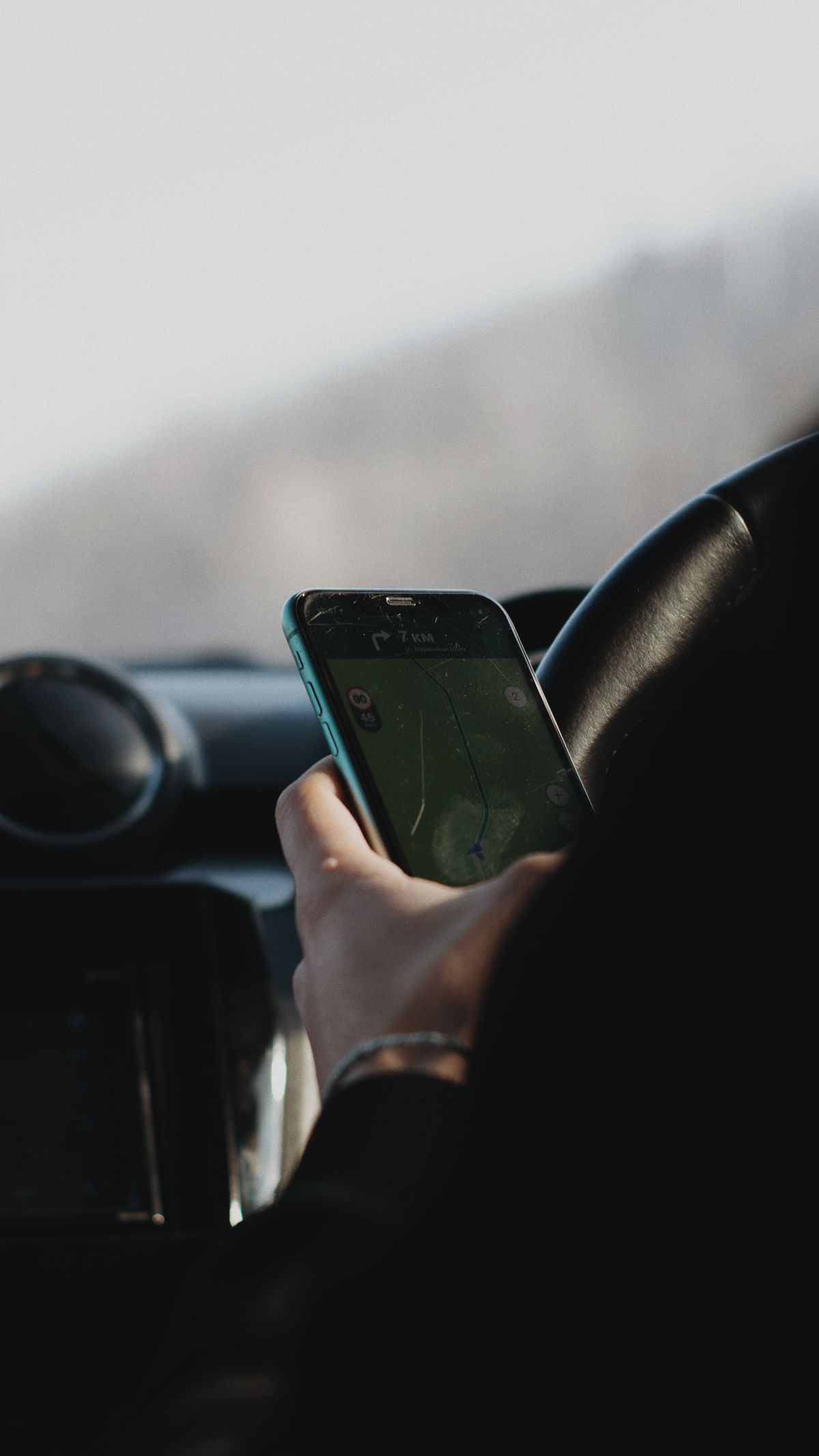 Person booking a ride on a smartphone