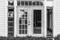 Grayscale Photo of Closed Door