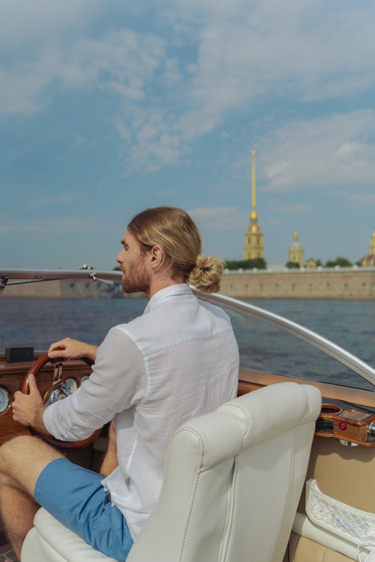 Man Driving A Boat