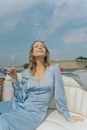 A Woman Drinking Wine in the Boat