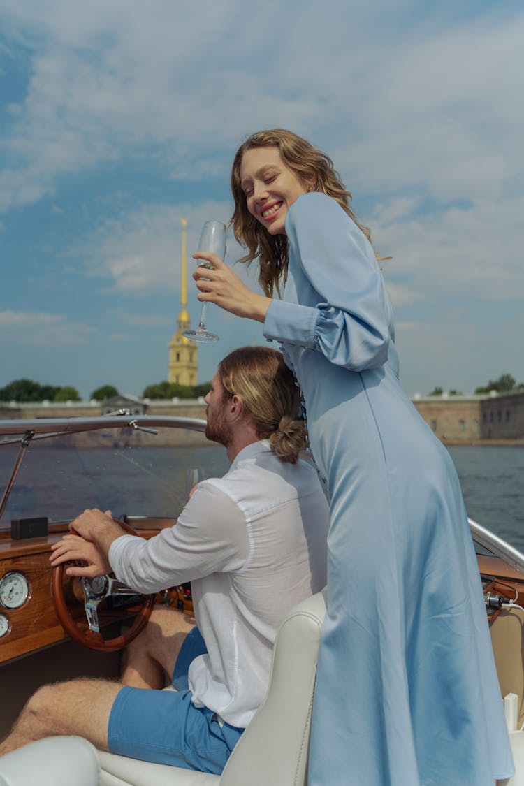 Couple Driving A Boat Together