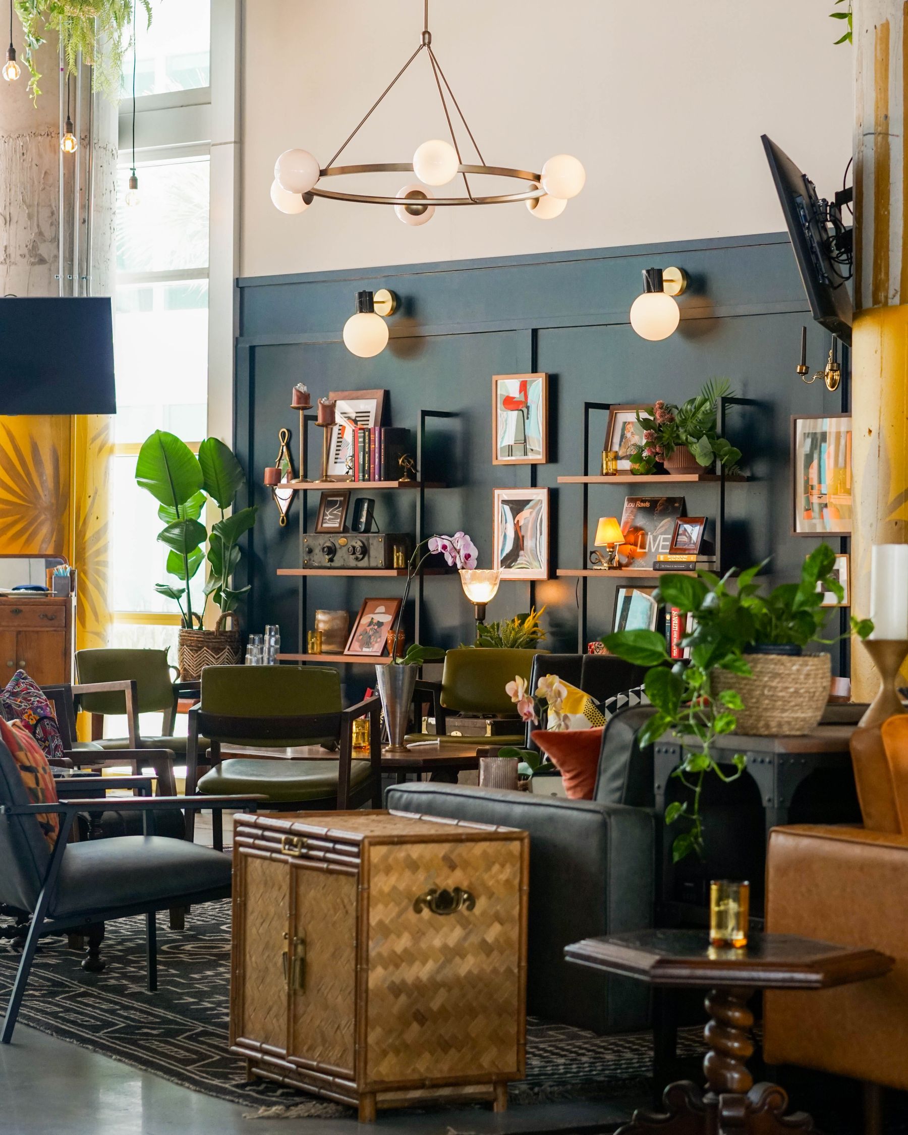 Classic interior with globe sconces, chandelier and layered warm illumination