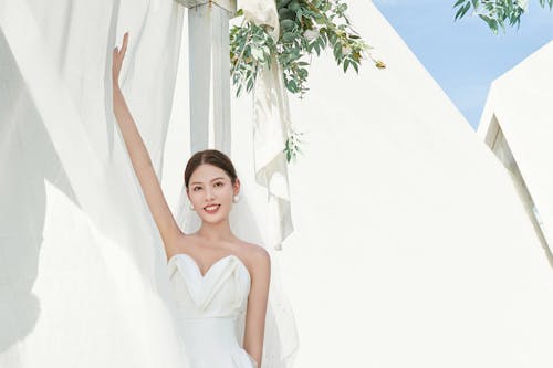 Free A Woman in Her White Wedding Dress  Stock Photo