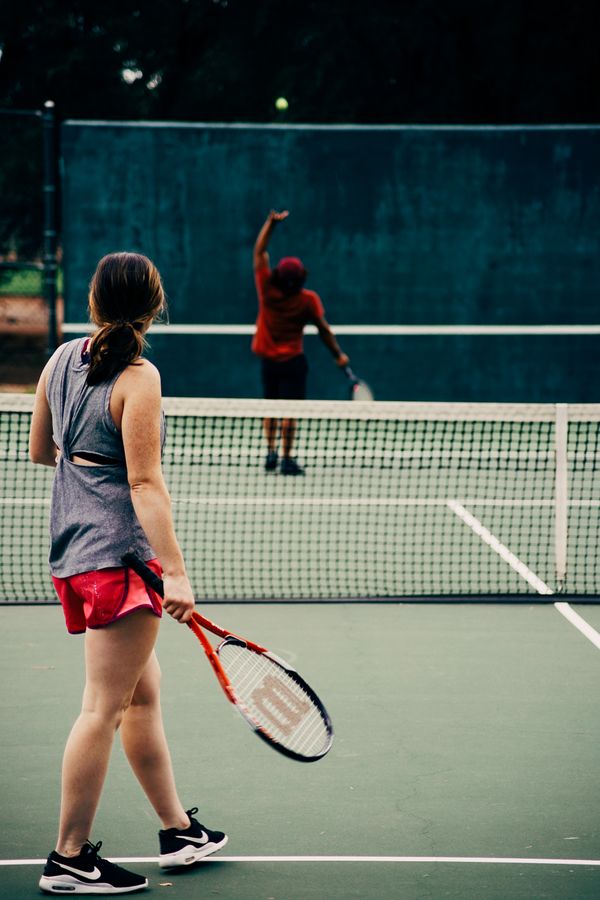 Tennis player preparing to serve