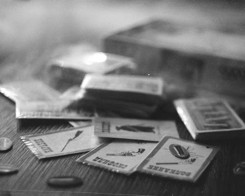 Free Grayscale Photo of Cards on a Wooden Surface Stock Photo