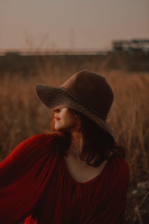 A Woman Wearing a Brown Hat · Free Stock Photo