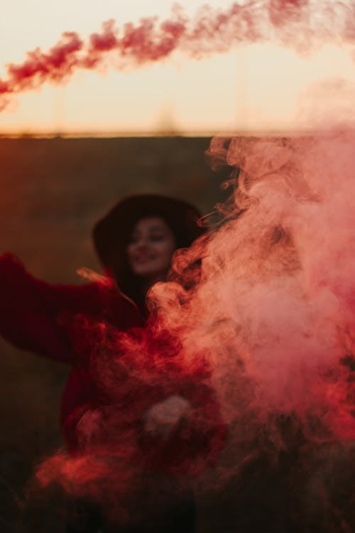 Woman Behind Red Smoke