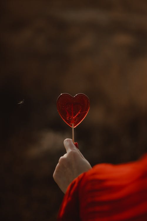 A Person Holding a Lollipop