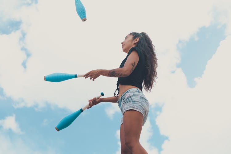 A Woman Doing Juggling