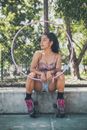 A Sitting Woman Holding a Hula Hoop