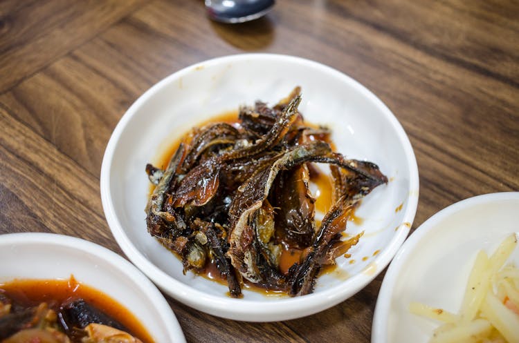 Oily Cooked Dried Fish In A Ceramic Plate