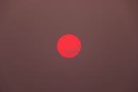 Red Sun on a Brown Sky