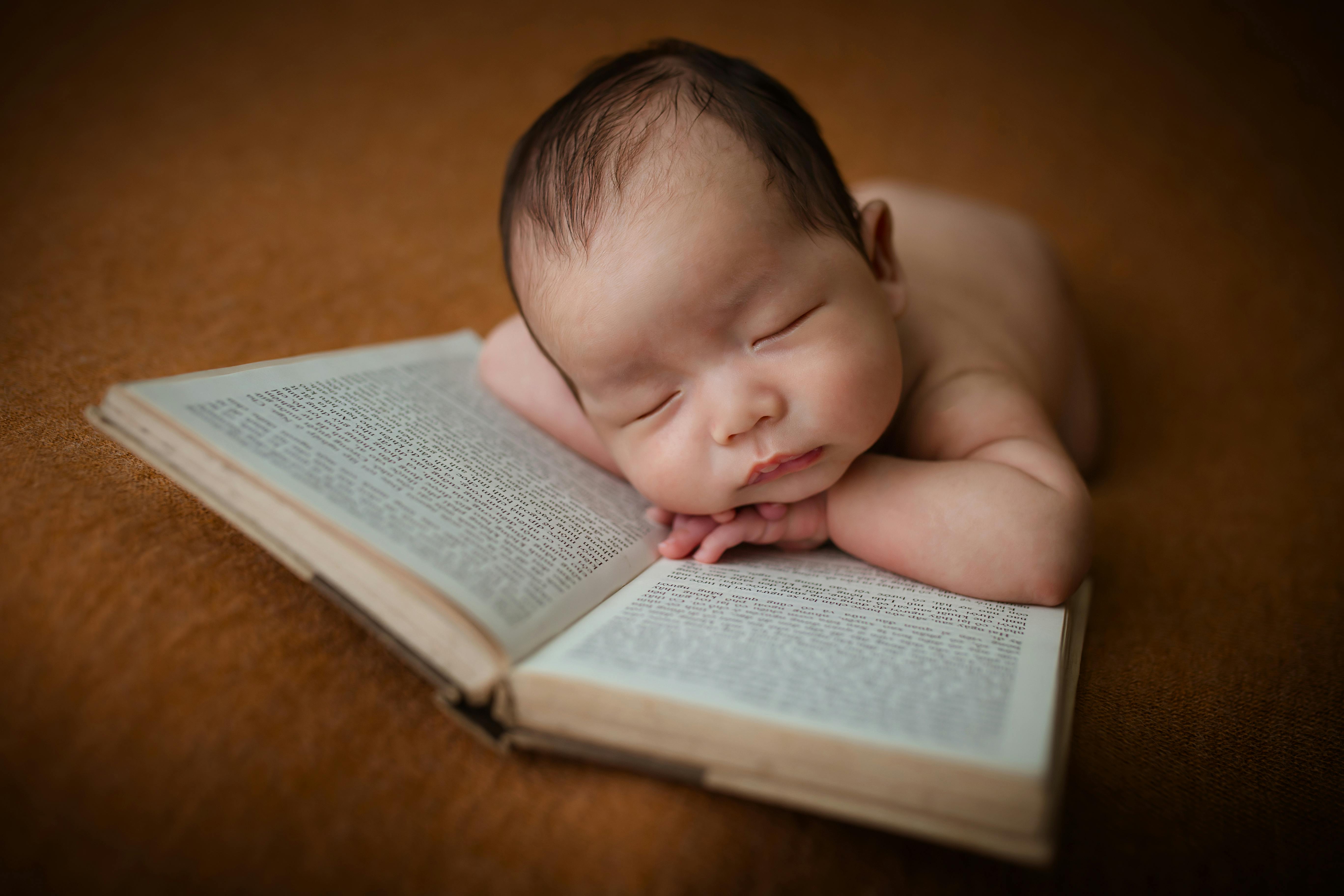 Baby Lying On White Fur With Brown Blanket · Free Stock Photo