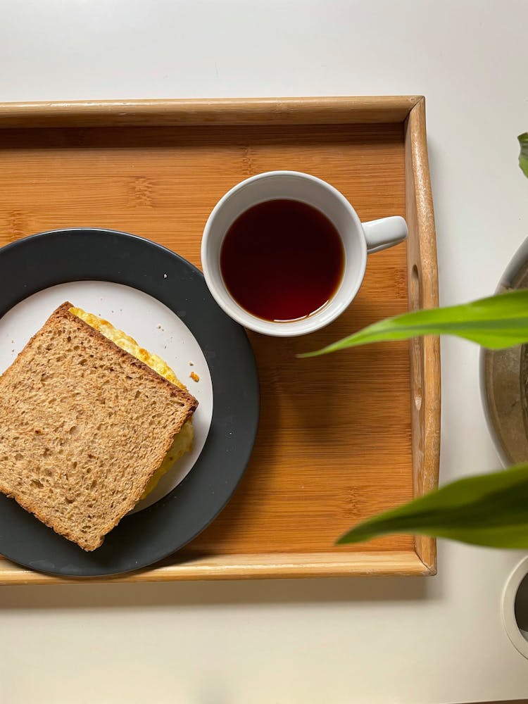 Sandwich Beside A Cup Of Tea