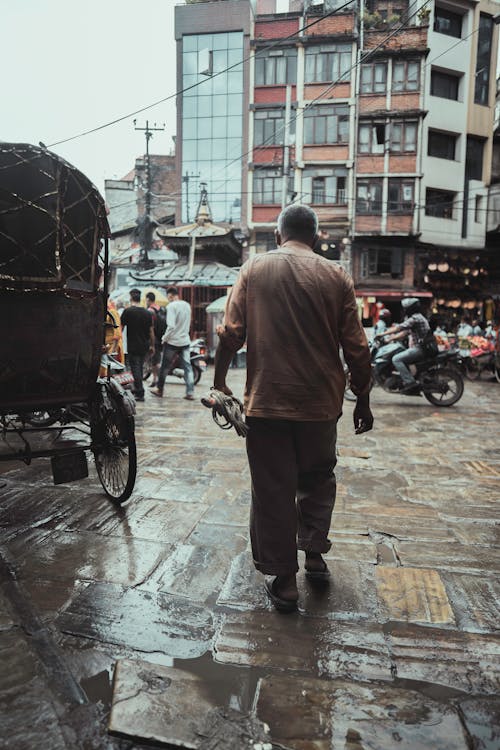 Backview of Person walking on a Market 