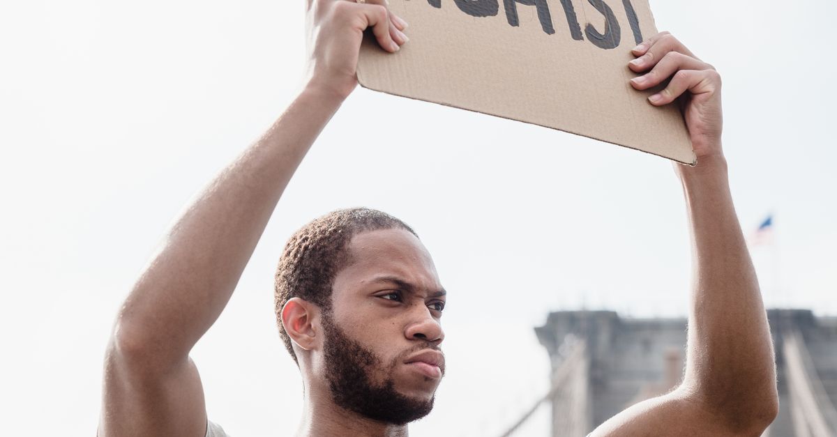 Man Rights Pictures Photo of a Man Raising a Human Rights Signage · Free Stock Photo
