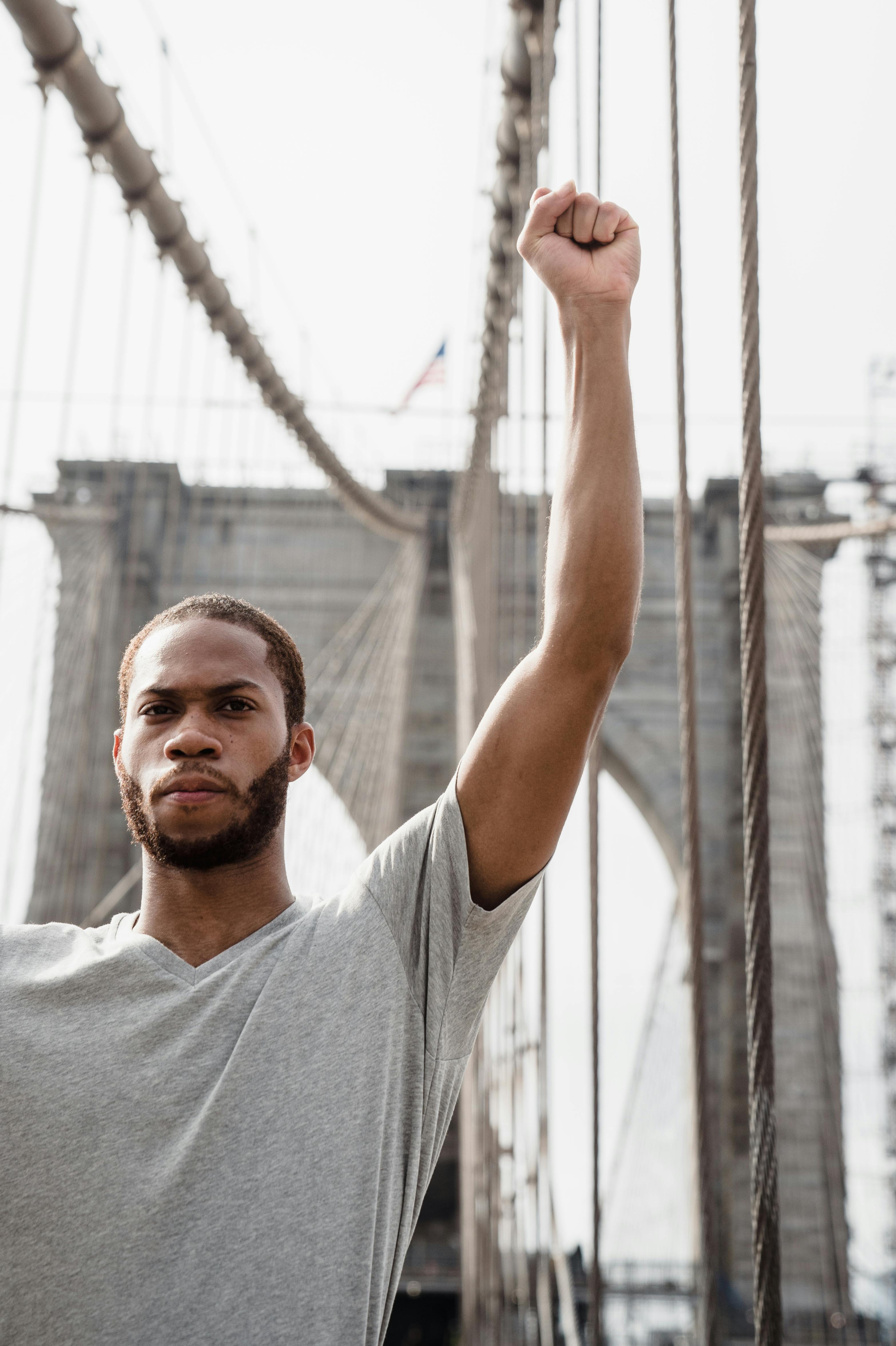 A Man Raising His Fist for a Nonviolent Protest Studio Shoot · Free Stock Photo A Man Raising His Fist for a Nonviolent Protest Studio Shoot · Free Stock Photo