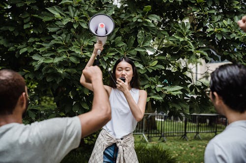 Free Photo of a Woman Using a Megaphone Stock Photo