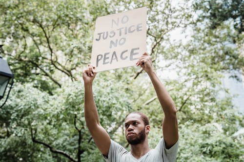 Free Protester holding a Slogan  Stock Photo
