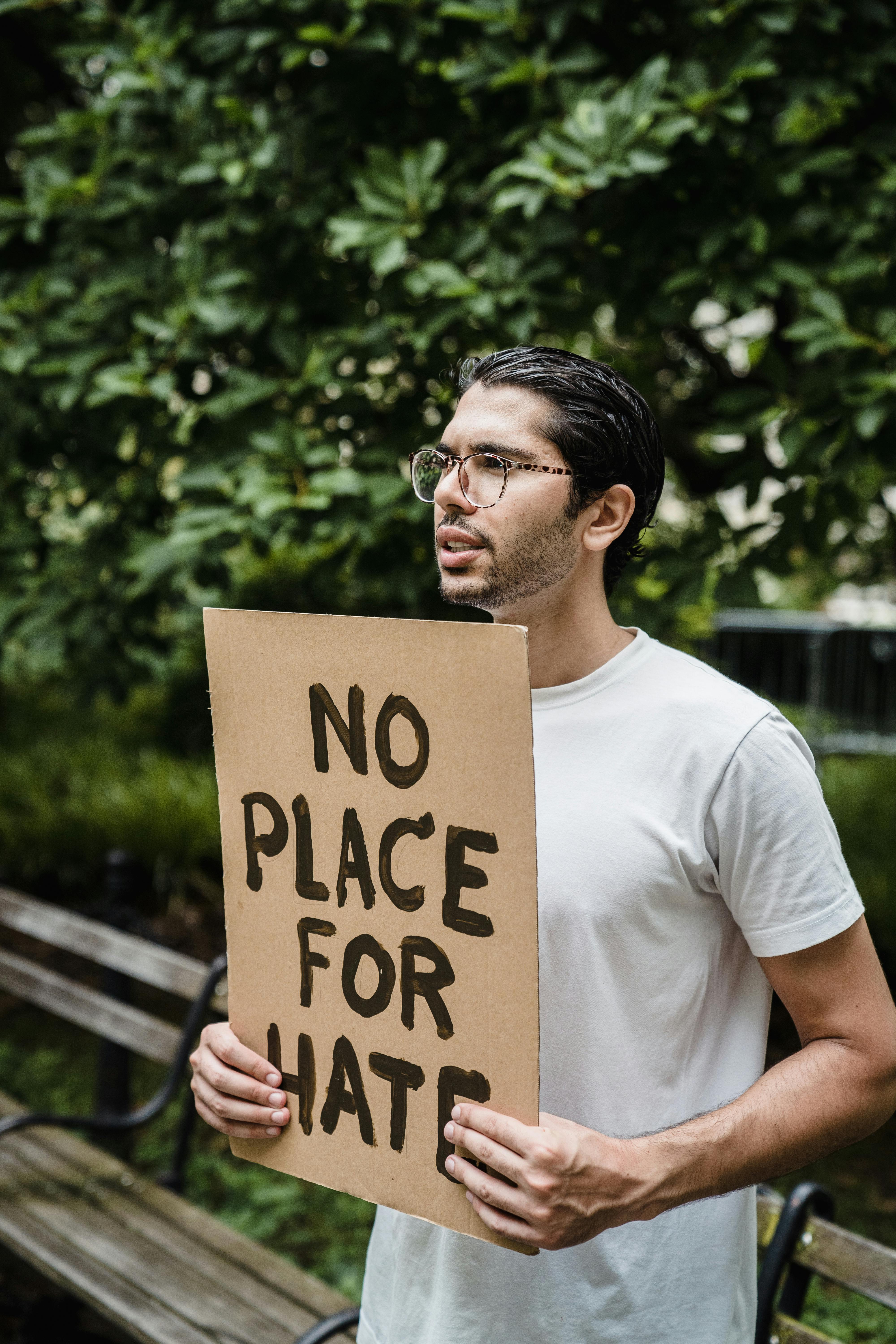 a man holding a placard