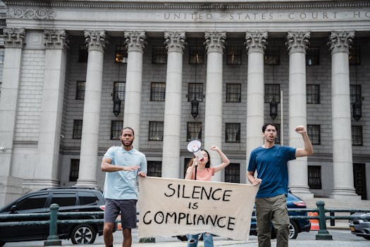 Protesters Holding a Banner with a Slogan